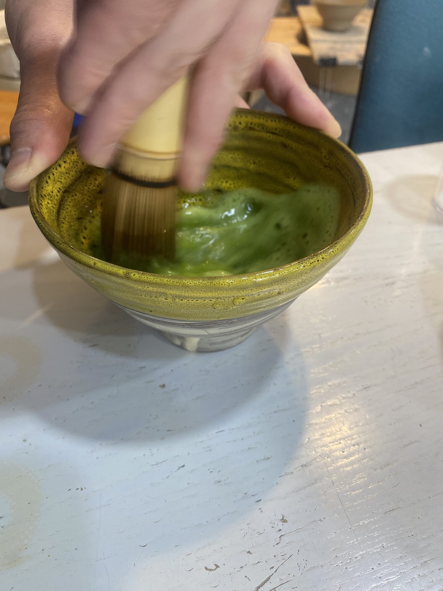 Whisking matcha by hand